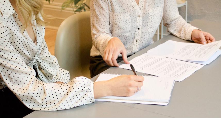 lady writing on a blank paper